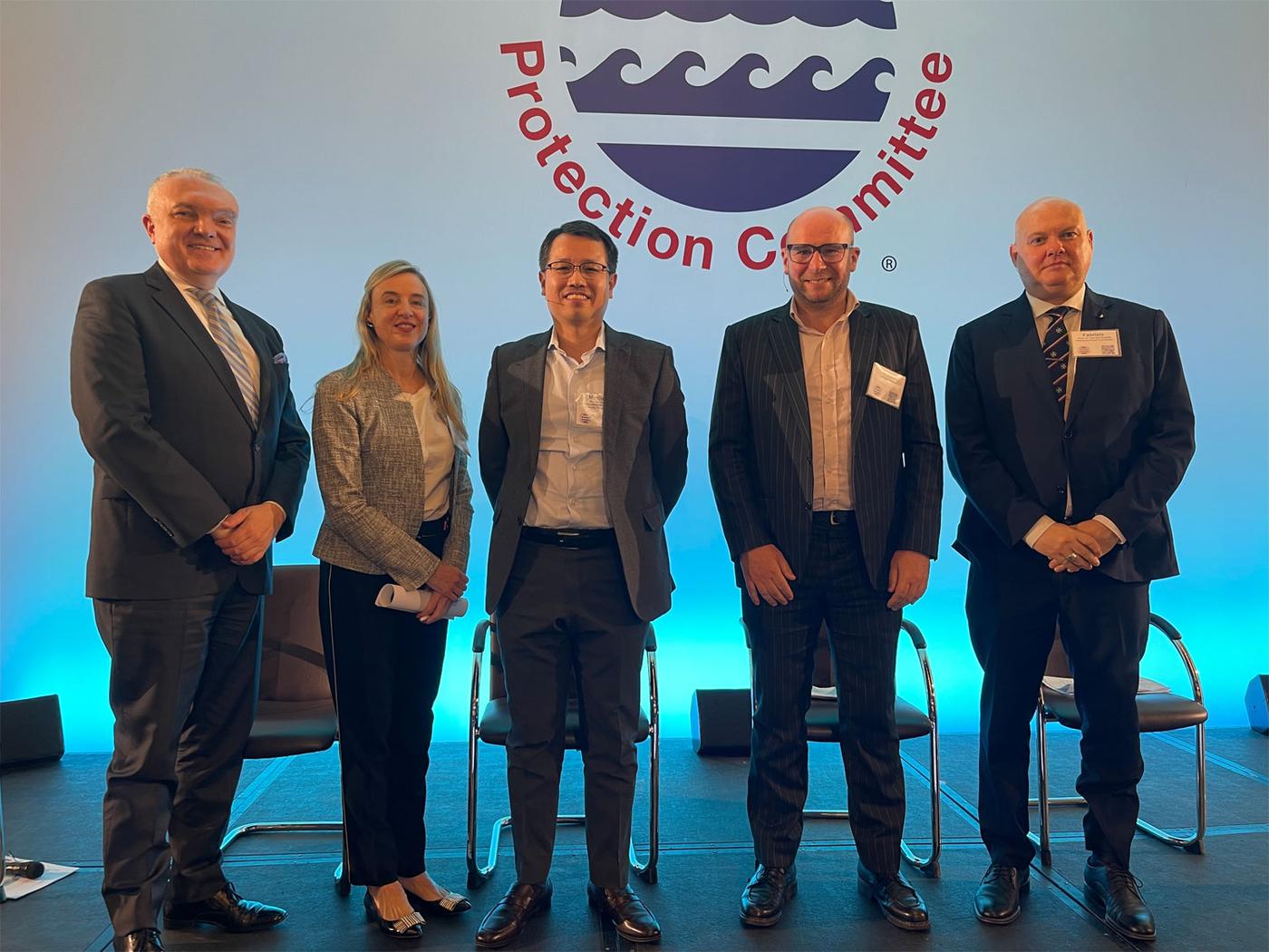 A group of panel speakers standing on stage at ICCC, including Kent Bressie, Dr Fabrizio Bozzato, Dr Franck Chevalier, Nadia Krivetz and Marcus Tong, in front of a conference backdrop.